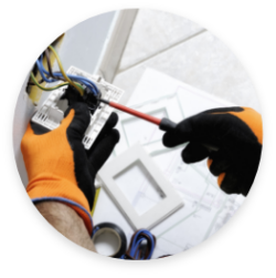 A person changing out an electrical outlet in house.