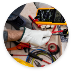 Someone using electrical tools to complete an electrical repair
