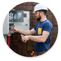 Man working on a open breaker box.