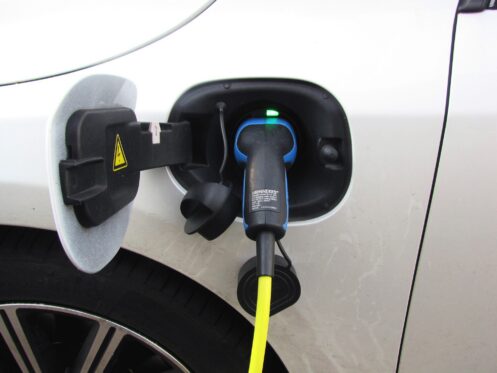Electric vehicle connected to a home EV charger in Fort Myers